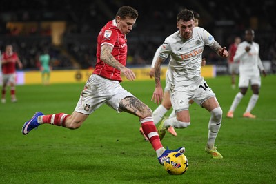191225 - Swansea City v Wrexham - Sky Bet Championship - Josh Tymon of Swansea City is challenged by James McClean of Wrexham