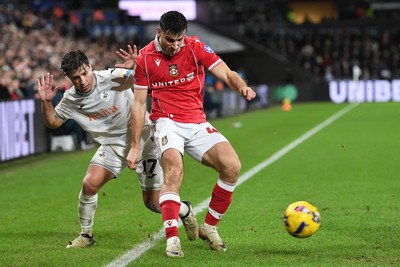 191225 - Swansea City v Wrexham - Sky Bet Championship - Goncalo Franco of Swansea City is challenged by Max Cleworth of Wrexham