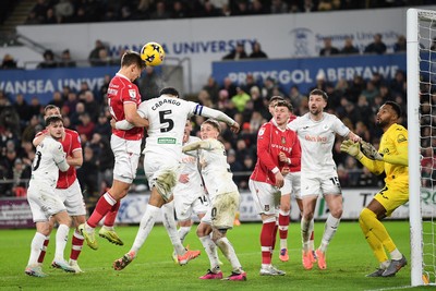 191225 - Swansea City v Wrexham - Sky Bet Championship - Max Cleworth of Wrexham heads at goal