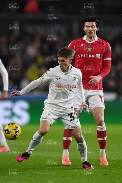 191225 - Swansea City v Wrexham - Sky Bet Championship - Kieffer Moore of Wrexham is challenged by Ethan Galbraith of Swansea City