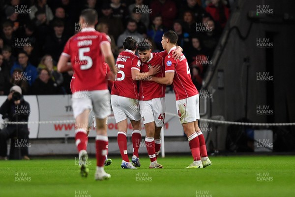 191225 - Swansea City v Wrexham - Sky Bet Championship - Wrexham players celebrate after Cameron Burgess of Swansea City scores an own goal