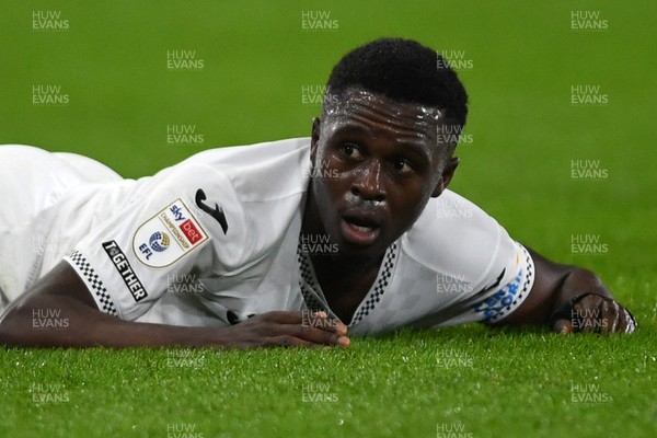 191225 - Swansea City v Wrexham - Sky Bet Championship - Zeidane Inoussa of Swansea City is challenged by James McClean of Wrexham