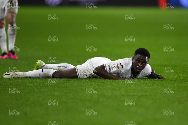 191225 - Swansea City v Wrexham - Sky Bet Championship - Zeidane Inoussa of Swansea City is challenged by James McClean of Wrexham