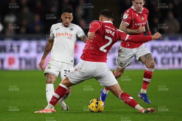 191225 - Swansea City v Wrexham - Sky Bet Championship - Ronald of Swansea City is challenged by Callum Doyle of Wrexham