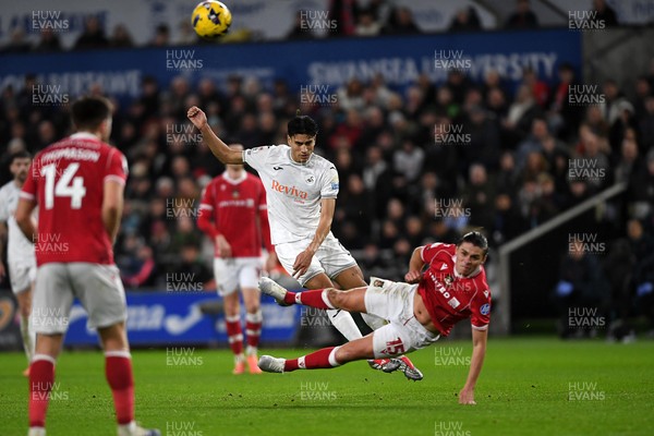 191225 - Swansea City v Wrexham - Sky Bet Championship - Marko Stamenic of Swansea City has his shot blocked by George Dobson of Wrexham