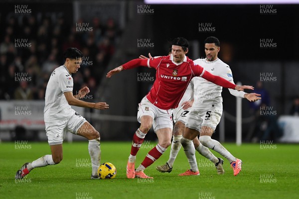 191225 - Swansea City v Wrexham - Sky Bet Championship - Kieffer Moore of Wrexham is challenged by Ben Cabango of Swansea City