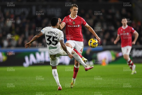 191225 - Swansea City v Wrexham - Sky Bet Championship - Max Cleworth of Wrexham is challenged by Ronald of Swansea City
