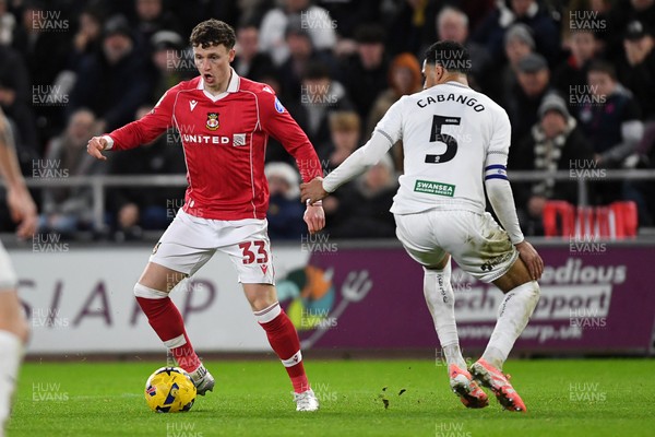 191225 - Swansea City v Wrexham - Sky Bet Championship - Nathan Broadhead of Wrexham is challenged by Ben Cabango of Swansea City