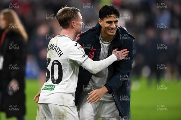 191225 - Swansea City v Wrexham - Sky Bet Championship - Ethan Galbraith of Swansea City celebrates the win at full time with Marko Stamenic of Swansea City