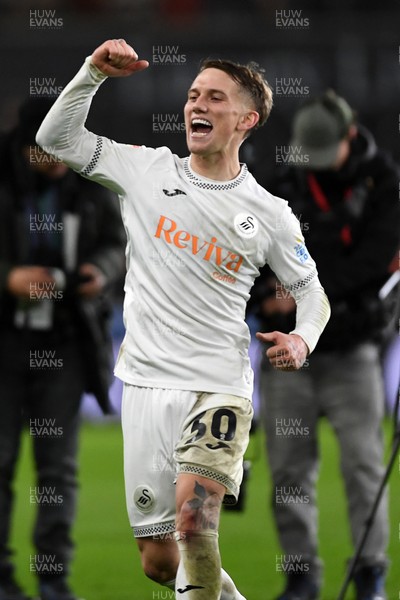 191225 - Swansea City v Wrexham - Sky Bet Championship - Ethan Galbraith of Swansea City celebrates the win at full time