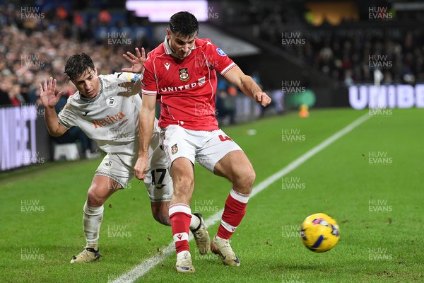 191225 - Swansea City v Wrexham - Sky Bet Championship - Goncalo Franco of Swansea City is challenged by Max Cleworth of Wrexham