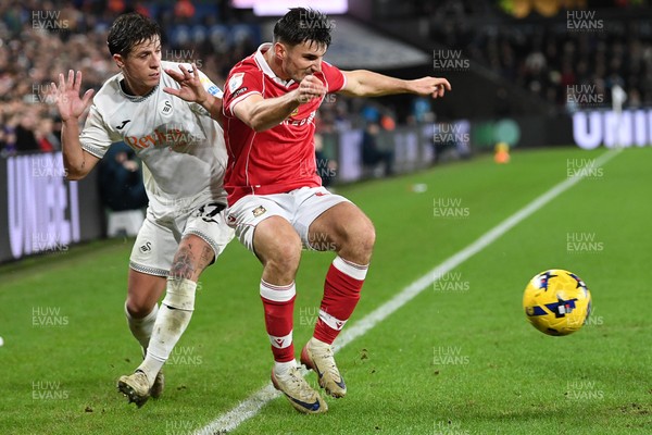 191225 - Swansea City v Wrexham - Sky Bet Championship - Goncalo Franco of Swansea City is challenged by Max Cleworth of Wrexham