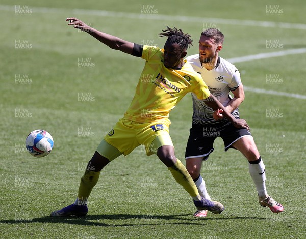 170421 - Swansea City - Wycombe Wanderers - SkyBet Championship - Admiral Muskwe of Wycombe Wanderers is challenged by Matt Grimes of Swansea City