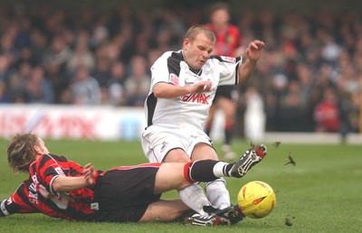 010105 - Swansea City v Yeovil Town - Swansea's  Andy Robinson goes down as Terry Skiverton challenges