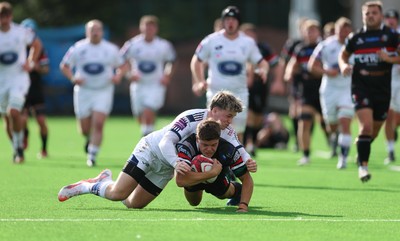 101026 Swansea RFC v Ebbw Vale, Super Rugbi Cymru - Morgan Rees of Ebbw Vale is tackled