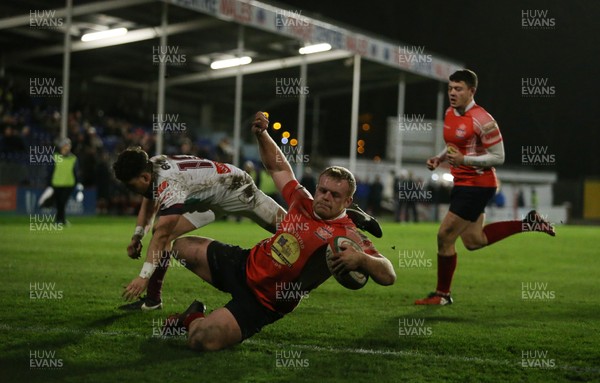 110117 - Swansea RFC v Llanelli RFC - Fosters Cup - Craig Thomas of Llanelli crashes over the line to score a try by Chris Fairweather/Huw Evans Agency