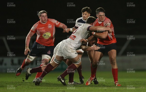 110117 - Swansea RFC v Llanelli RFC - Fosters Cup - Olly Reyland of Llanelli is tackled by Rory Gallagher of Swansea by Chris Fairweather/Huw Evans Agency