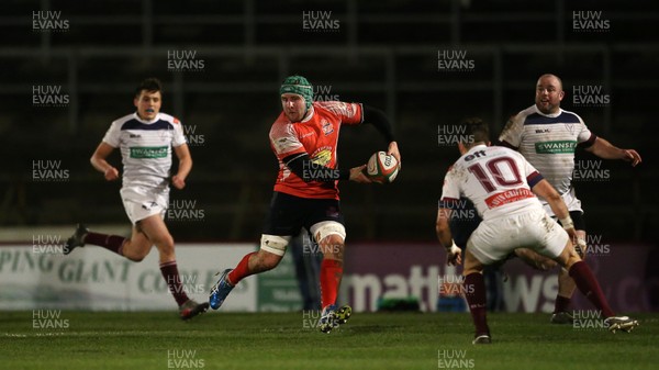 110117 - Swansea RFC v Llanelli RFC - Fosters Cup - Nathan Hart of Llanelli is challenged by Iestyn Wilson of Swansea by Chris Fairweather/Huw Evans Agency