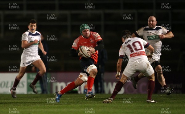 110117 - Swansea RFC v Llanelli RFC - Fosters Cup - Nathan Hart of Llanelli is challenged by Iestyn Wilson of Swansea by Chris Fairweather/Huw Evans Agency