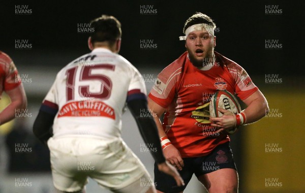 110117 - Swansea RFC v Llanelli RFC - Fosters Cup - Dylan Phillips of Llanelli is challenged by Richard Williams of Swansea by Chris Fairweather/Huw Evans Agency