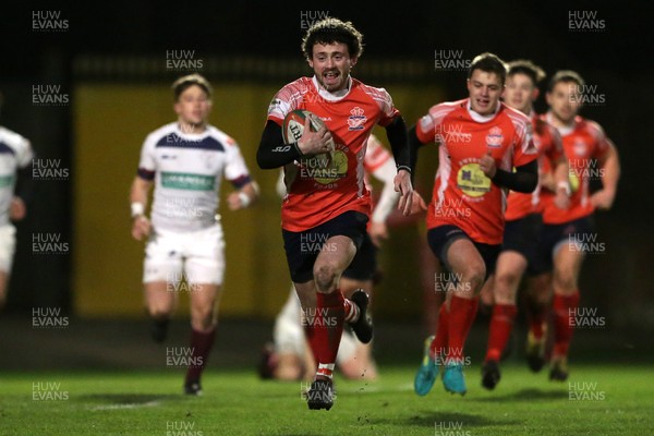 110117 - Swansea RFC v Llanelli RFC - Fosters Cup - Tom Howell of Llanelli runs in to score a try by Chris Fairweather/Huw Evans Agency