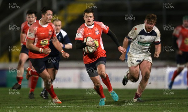 110117 - Swansea RFC v Llanelli RFC - Fosters Cup - Ioan Hughes of Llanelli makes a break by Chris Fairweather/Huw Evans Agency