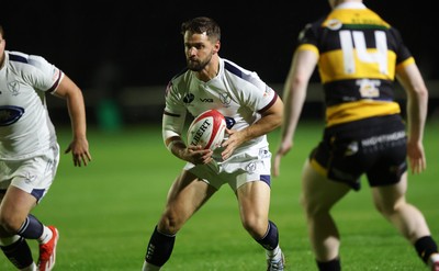 021025 - Swansea RFC v Newport RFC, Super Rygbi Cymru - Joe Thomas of Swansea takes on Finn Baker of Newport