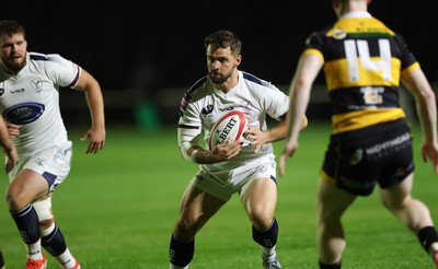 021025 - Swansea RFC v Newport RFC, Super Rygbi Cymru - Joe Thomas of Swansea takes on Finn Baker of Newport