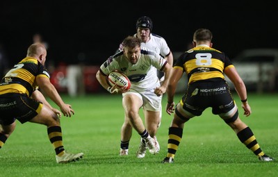 021025 - Swansea RFC v Newport RFC, Super Rygbi Cymru - Callum Bowden of Swansea takes on Henry Palmer of Newport and Cerrig Smith of Newport