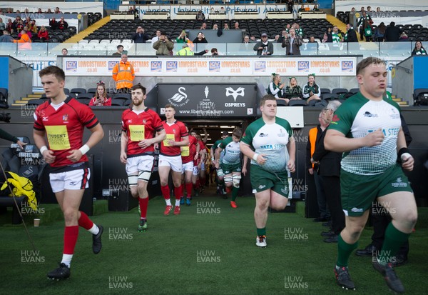 250418 - Swansea University v Cardiff University, Welsh Varsity rugby match - The two team head out onto the pitch at the start of the match
