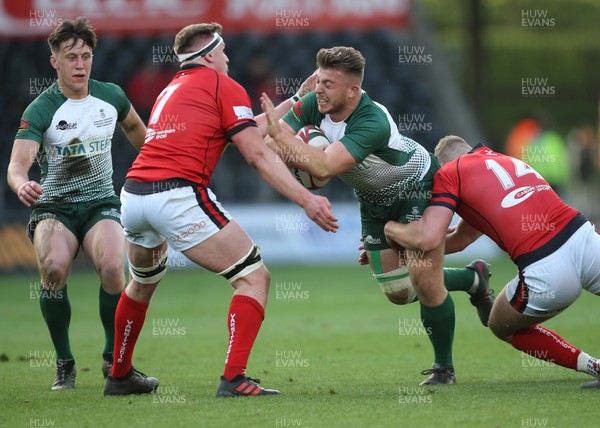 250418 - Swansea University v Cardiff University, Welsh Varsity rugby match - Matthew Pearce of Swansea University is tackled by Harry Griffiths of Cardiff University and Alex Everett of Cardiff University