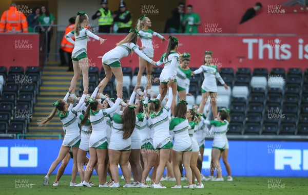 250418 - Swansea University v Cardiff University, Welsh Varsity rugby match - Cheerleaders from Swansea University go through their routine at half time