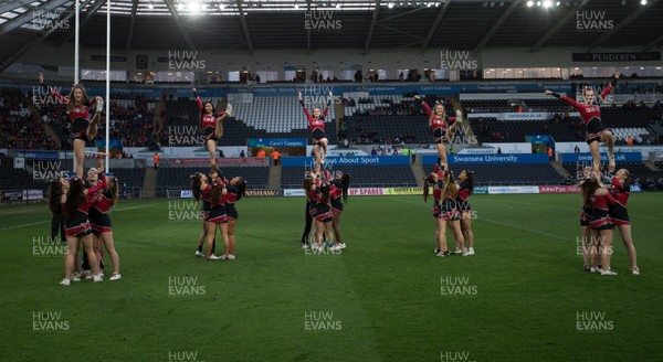 250418 - Swansea University v Cardiff University, Welsh Varsity rugby match - Cheerleaders from Cardiff University go through their routine at half time