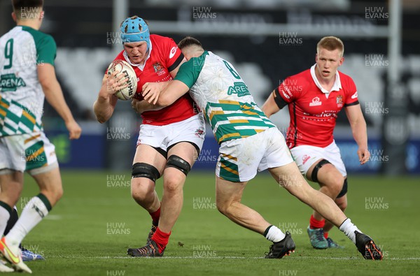 270422 - Welsh Varsity - Swansea University v Cardiff University - Ethan Phillips of Cardiff is tackled by Cai Davies of Swansea
