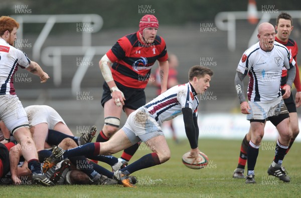 230313 - Swansea v Aberavon - SWALEC Cup Quarter Final -Jake Cole of Swansea gets the ball away 