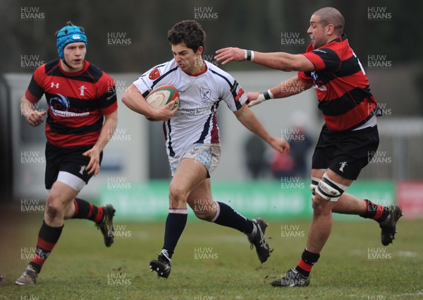 230313 - Swansea v Aberavon - SWALEC Cup Quarter Final -Cameron Clement of Swansea takes on Ian Moore of Aberavon 