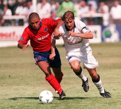 090897 - Swansea City v Brighton - Jon Coates of Swansea pushes past Jeff Minton