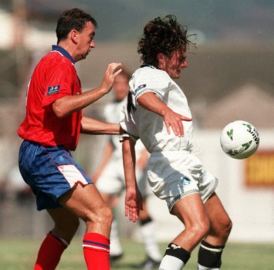 090897 - Swansea City v Brighton - David Puttman of Swansea is tackled by Mark Morris