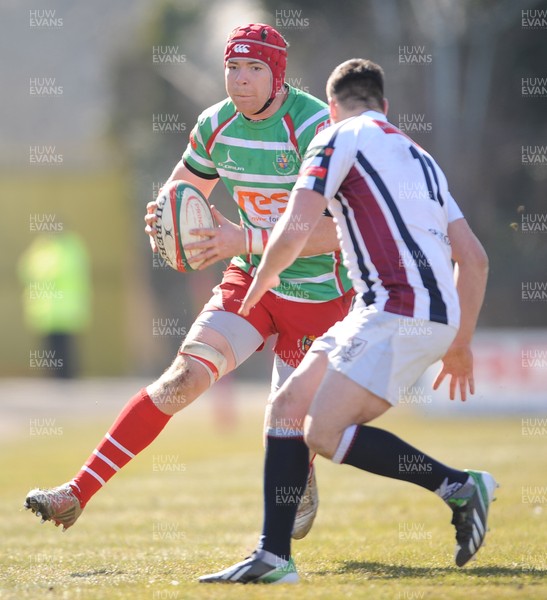 060413 - Swansea v Llandovery - Principality Premiership -Kieran Murphy of Llandovery is tackled by Rhys Williams of Swansea 