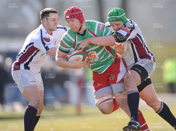 060413 - Swansea v Llandovery - Principality Premiership -Kieran Murphy of Llandovery is tackled by Rhys Williams and Scott Otten of Swansea 