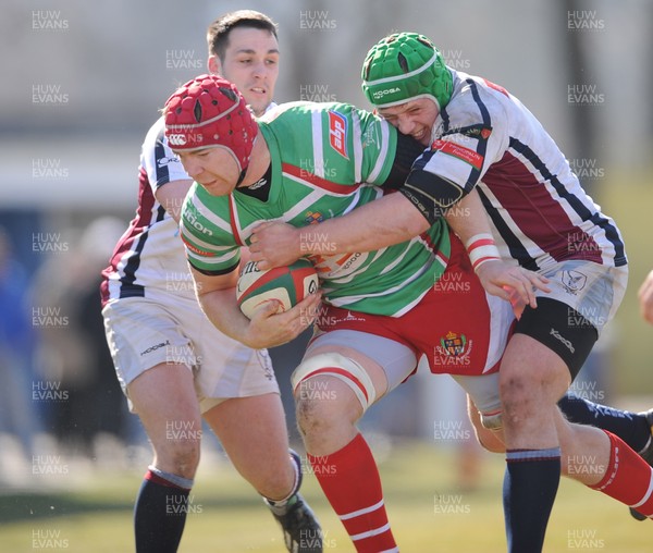 060413 - Swansea v Llandovery - Principality Premiership -Kieran Murphy of Llandovery is tackled by Rhys Williams and Scott Otten of Swansea 