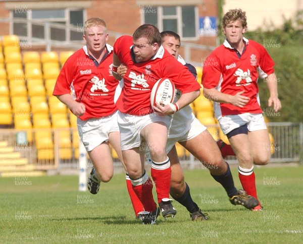 200903 - Swansea v Llanelli - Welsh Premiership - Llanelli's Justin Hughes surges forward