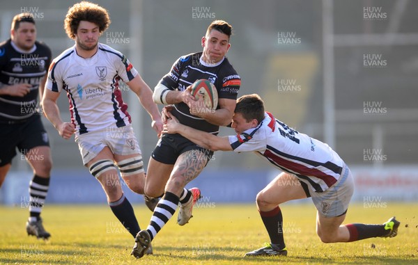 020313 - Swansea v Pontypridd - Principality Premiership -Gareth James of Pontypridd is tackled by Jamie Thomas of Swansea