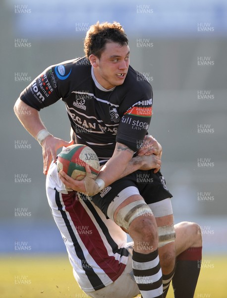 020313 - Swansea v Pontypridd - Principality Premiership -Jake Thomas of Pontypridd is tackled by Richard Williams of Swansea