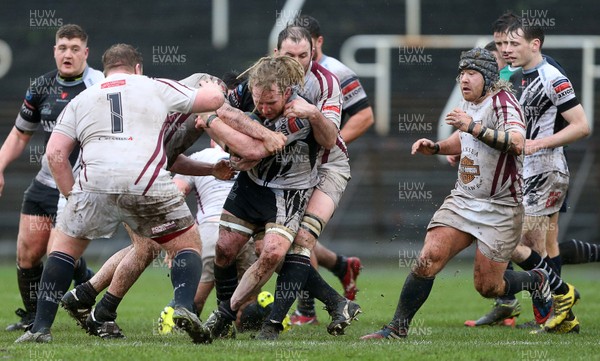 090116 - Swansea RFC v Pontypridd - SWALEC Cup - Wayne O'Connor of Pontypridd is tackled by Sam Kelly of Swansea