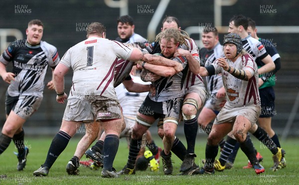 090116 - Swansea RFC v Pontypridd - SWALEC Cup - Wayne O'Connor of Pontypridd is tackled by Sam Kelly of Swansea