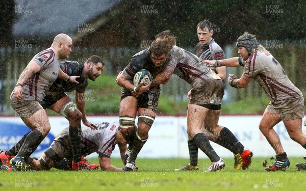 090116 - Swansea RFC v Pontypridd - SWALEC Cup - Henri Barnes of Pontypridd is tackled by Tom Williams of Swansea