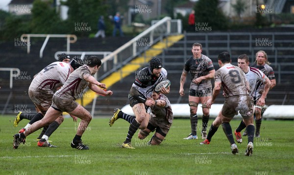 090116 - Swansea RFC v Pontypridd - SWALEC Cup - Adam Thomas of Pontypridd tries to break the Swansea defence