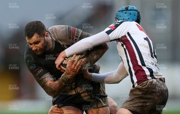 090116 - Swansea RFC v Pontypridd - SWALEC Cup - Chris Dicomidis of Pontypridd is tackled by Andrew Claypole of Swansea