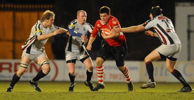 12.03.10 - Principality Premiership Rugby, Swansea v Pontypridd Ponty's Adam Thomas tries to get through 